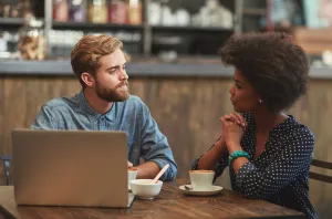 Two people engaged in a meaningful conversation built on trust, listening, and understanding